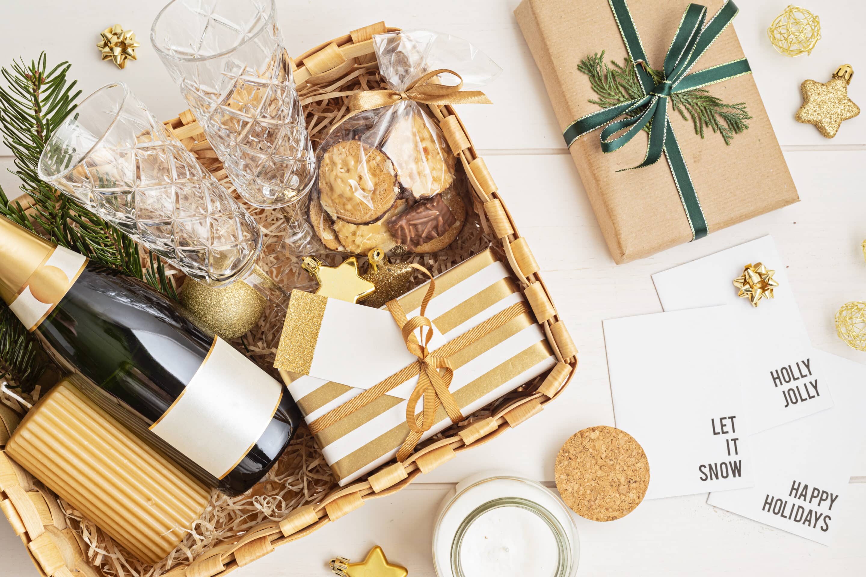 Refined Christmas gift basket for romantic holidays with bottle of champagne, wine glasses
